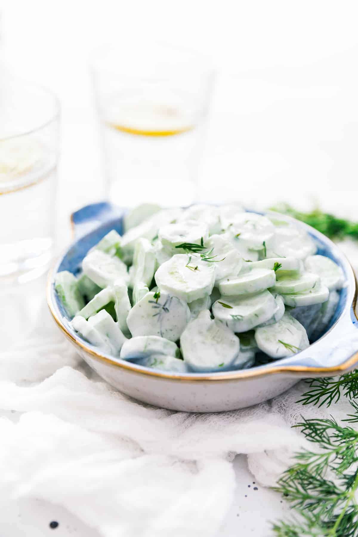 Midwestern Creamy Cucumber and Vinegar Salad made with fresh cucumbers, sour cream, vinegar, and fresh herbs, a summer stable for every picnic and cookout!