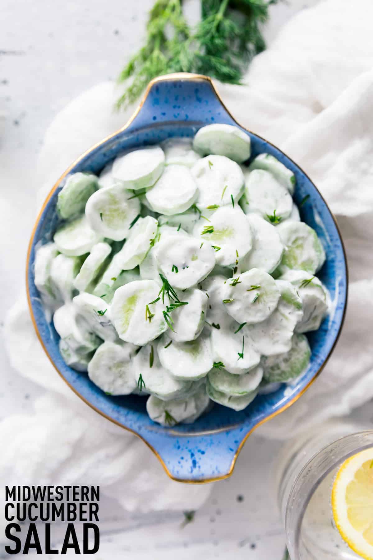 Midwestern Creamy Cucumber and Vinegar Salad made with fresh cucumbers, sour cream, vinegar, and fresh herbs, a summer stable for every picnic and cookout! 