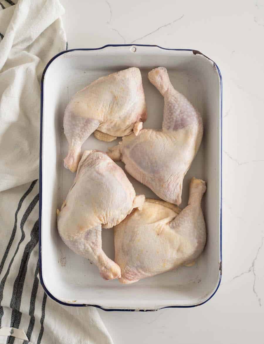 pan with raw chicken in it before being cooked