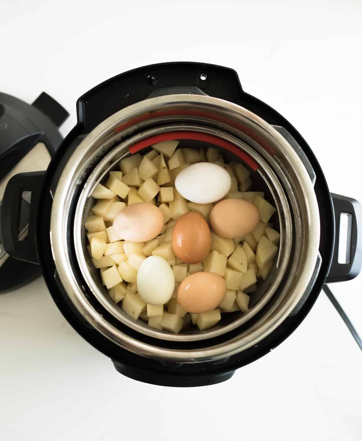 overhead image of eggs and potatoes in instant pot