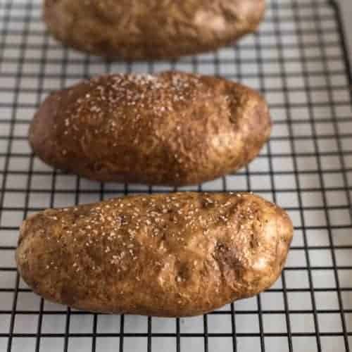 baked potato with salt on a cooling rack