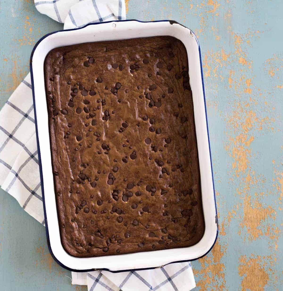 white pan with baked brownies in it.