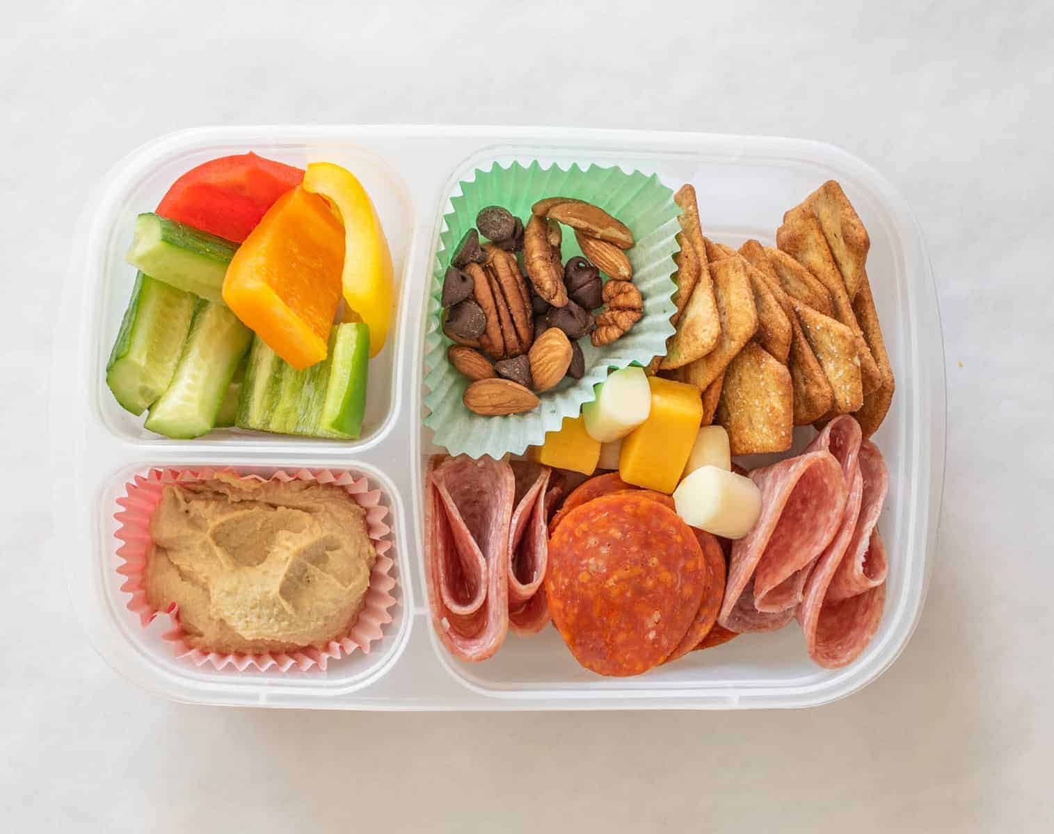 Quick and easy school and adult lunch box ideas made with Sabra Hummus, fruit, vegetables, and more.