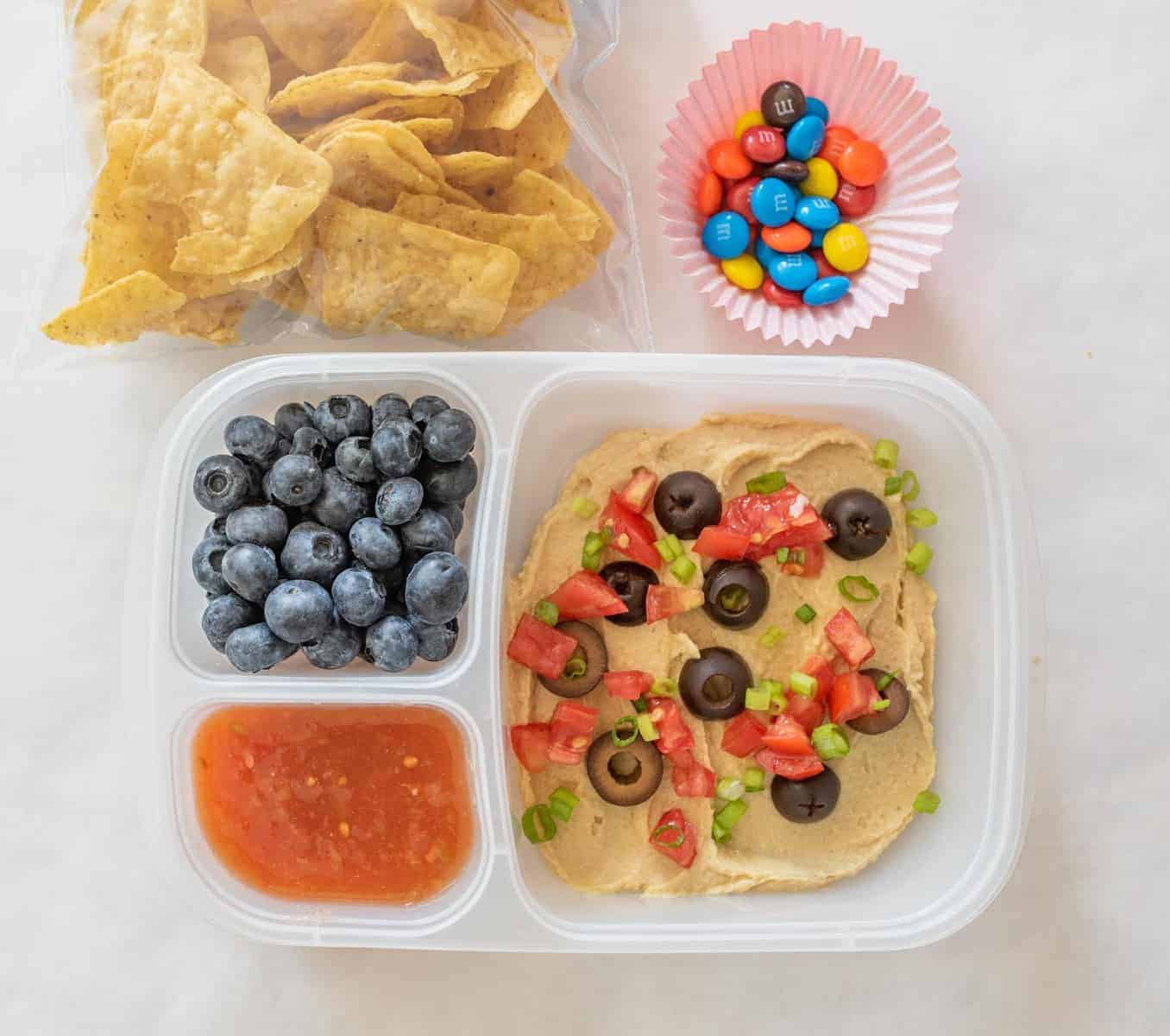 Quick and easy school and adult lunch box ideas made with Sabra Hummus, fruit, vegetables, and more. 