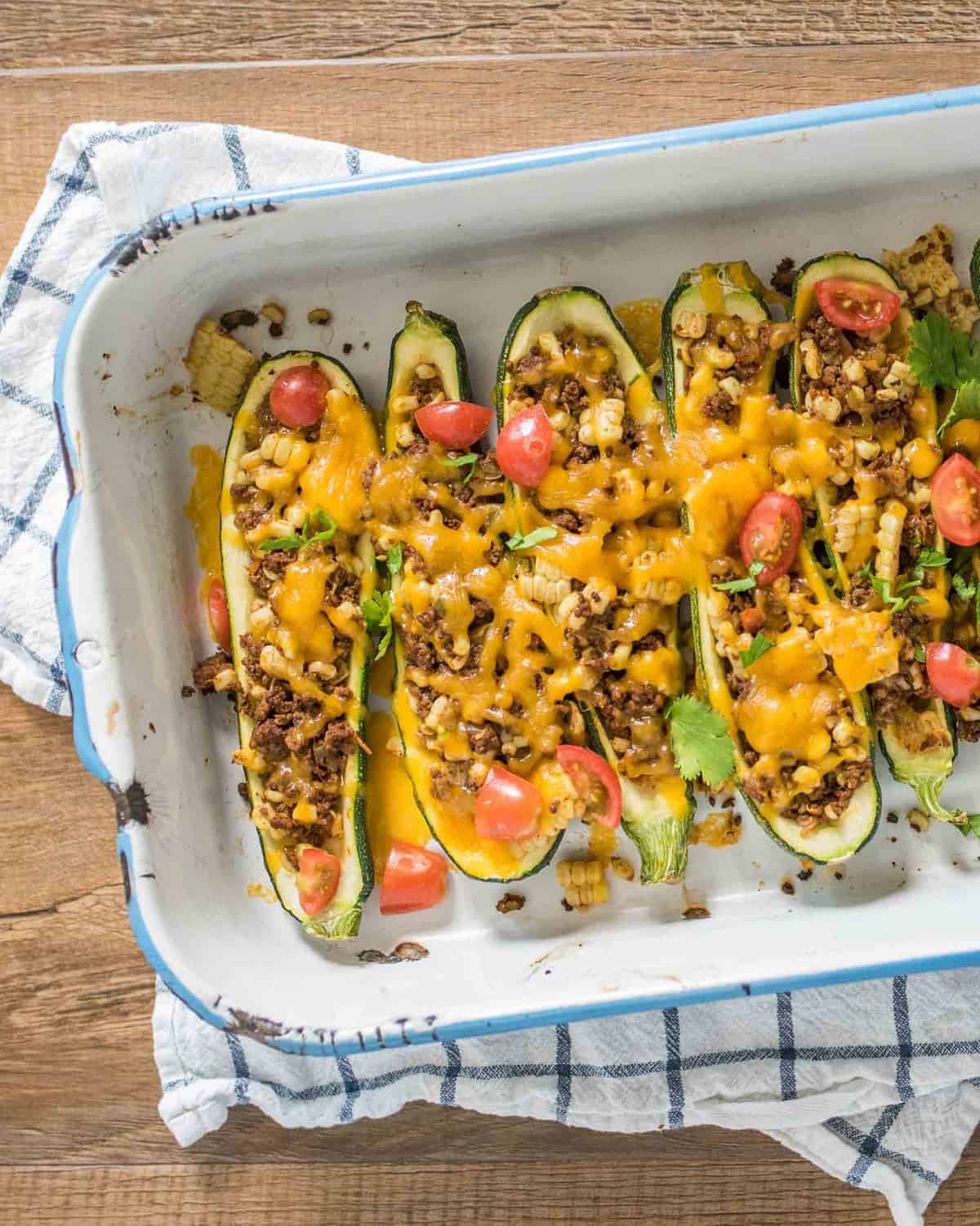 Quick and easy taco zucchini boats made with a simple taco meat and corn mixture, cheese, and zucchini and all done in about 30 minutes.