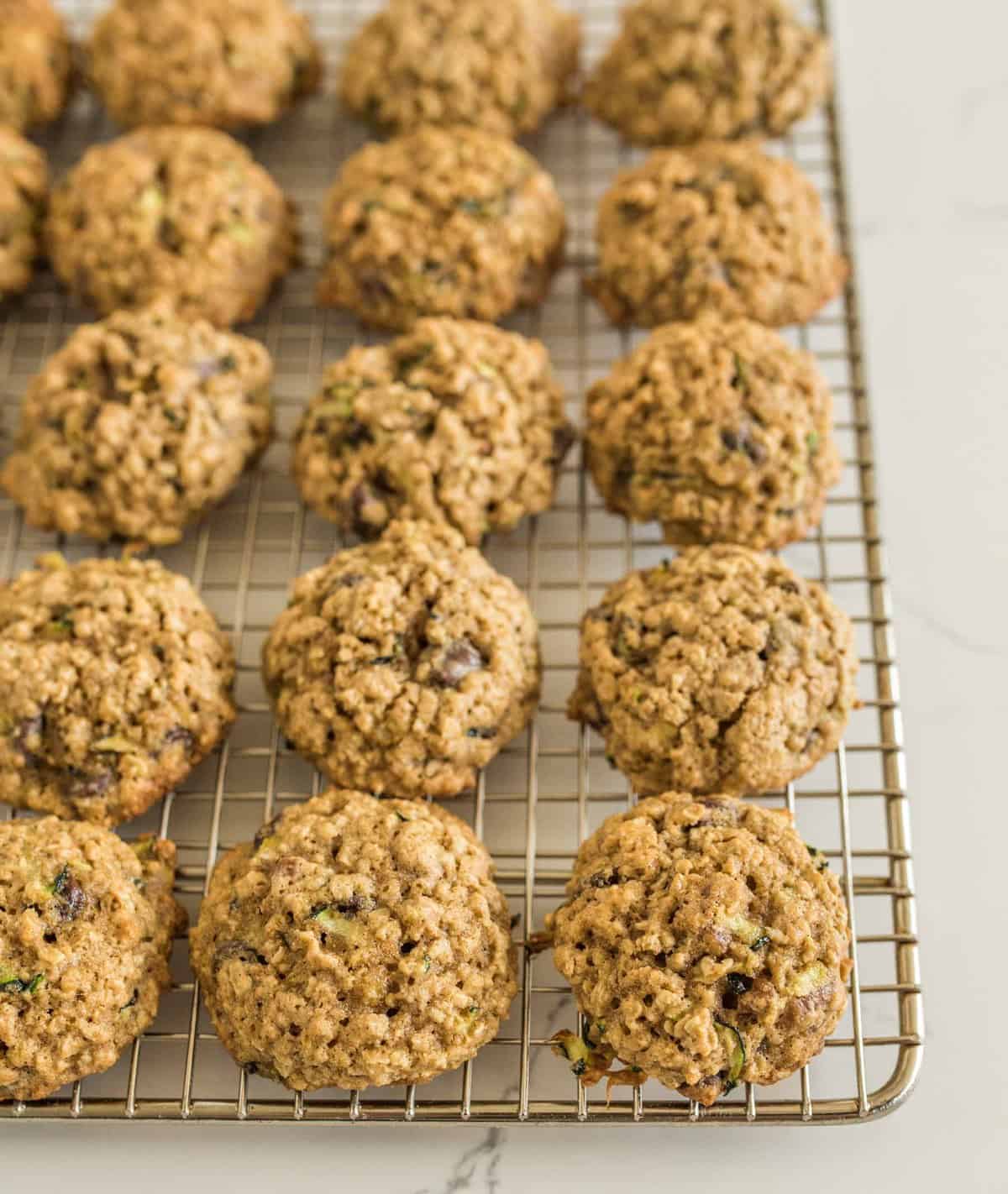 Chocolate Chip Oatmeal Zucchini cookies made with whole wheat flour, oats, chocolate chips, pecans, and shredded zucchini.