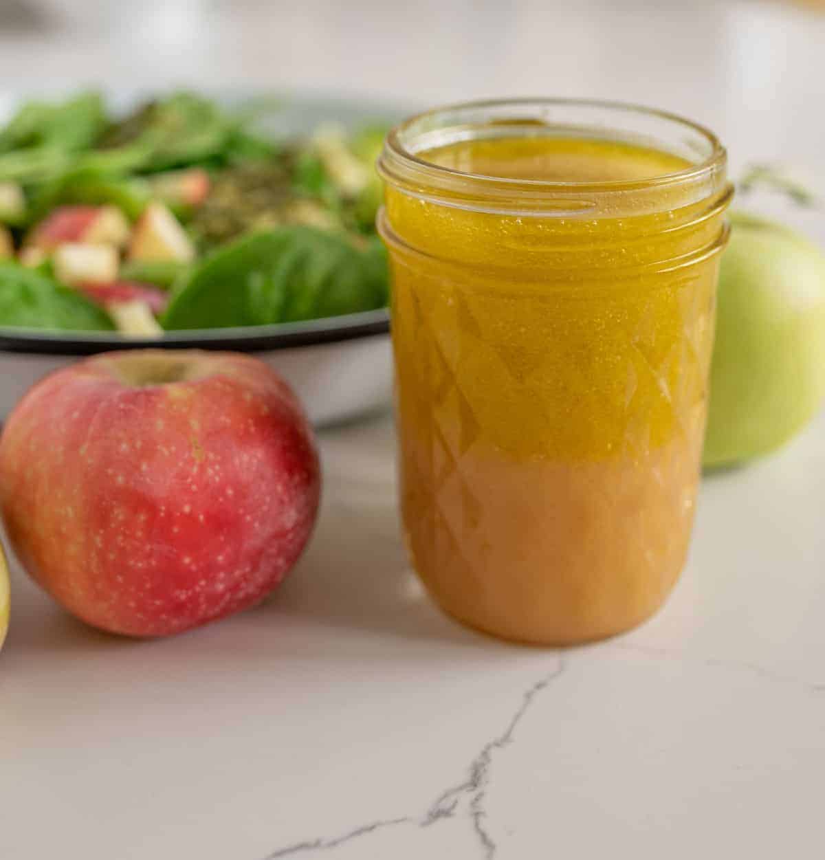 Quick and easy spinach salad recipe with apples, pumpkin seeds, and a simple flavor-filled apple vinaigrette dressing to go with it. 