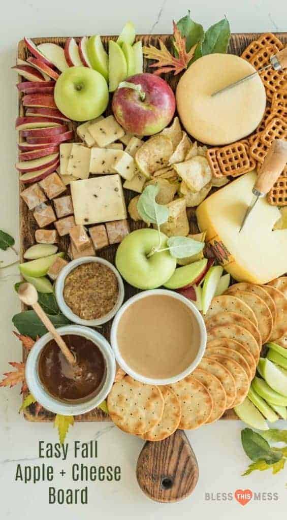 Top view of Easy Fall Apple and Cheese Board with a variety of crackers, cheeses, apples, and dips