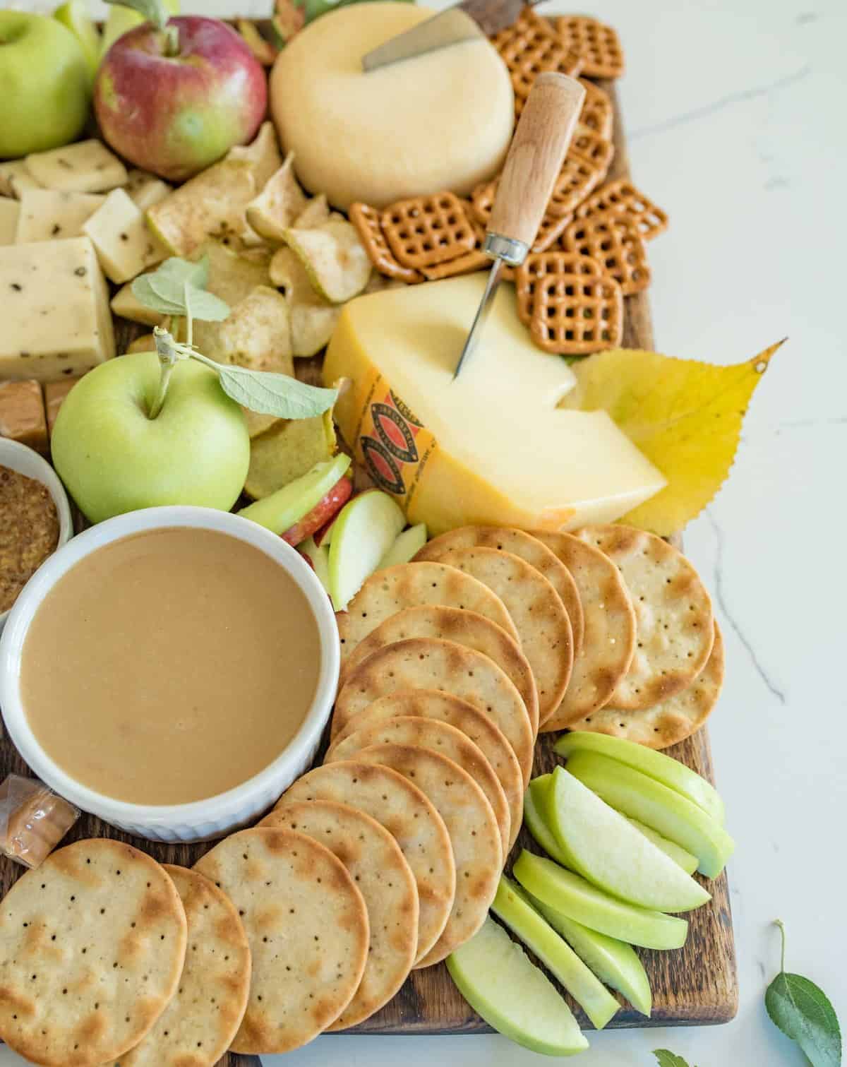 How to make a simple fall apple and cheese board that is perfect for snacking, an appetizer, parties, or just a slow evening in.