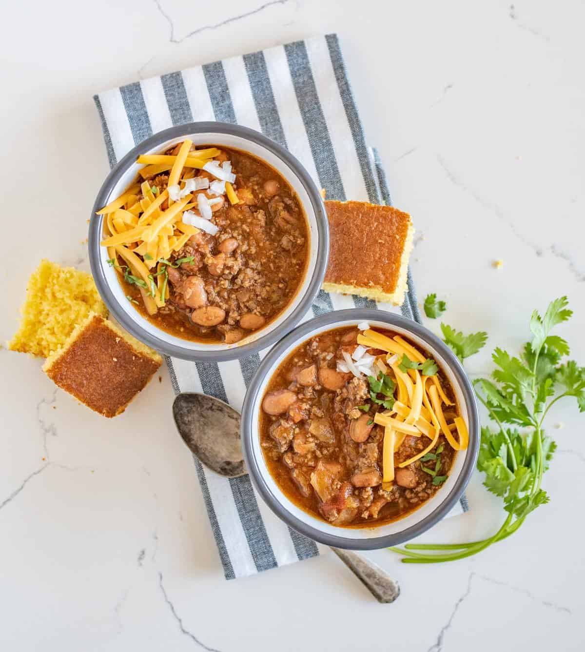 Quick and easy slow cooker chili made with all the classics like beans, tomatoes, and ground beef but contains two other surprising ingredients that will add tons of flavor with no extra work.