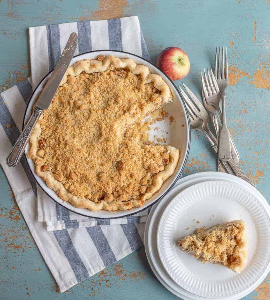 Image of a Dutch Apple Pie with One Slice on a Plate