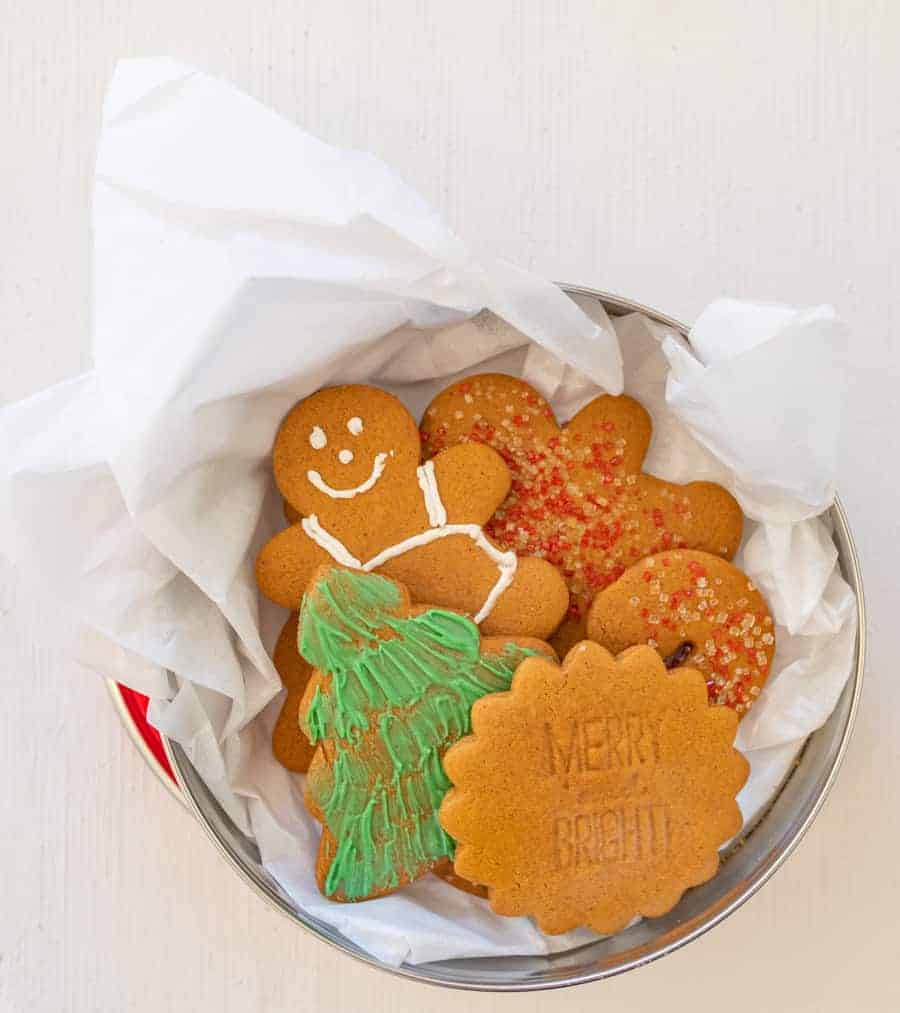 Christmas cookies in a tissue paper lined tin