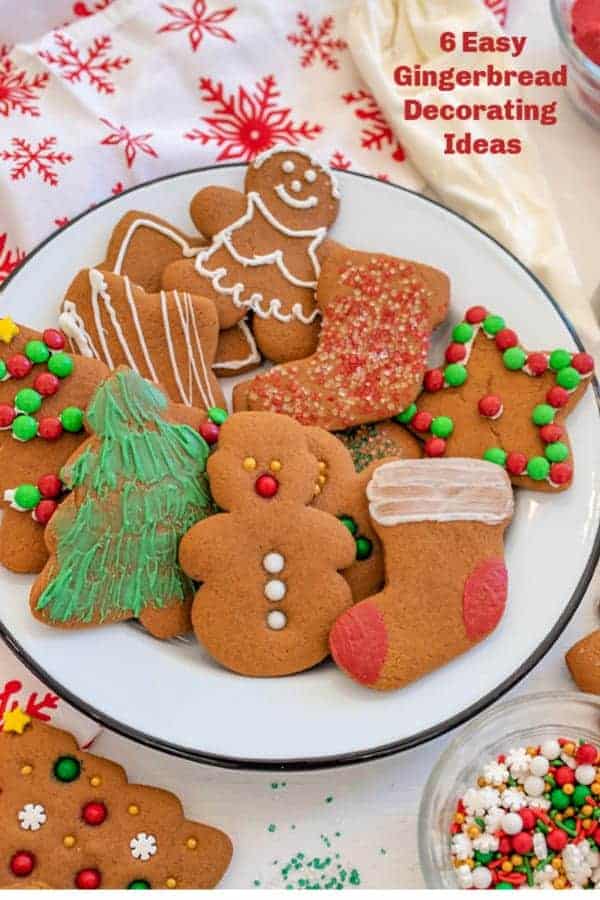 Title Image for 6 Easy Gingerbread Decorating Ideas and a white plate of gingerbread cookies in a variety of shapes and decorations