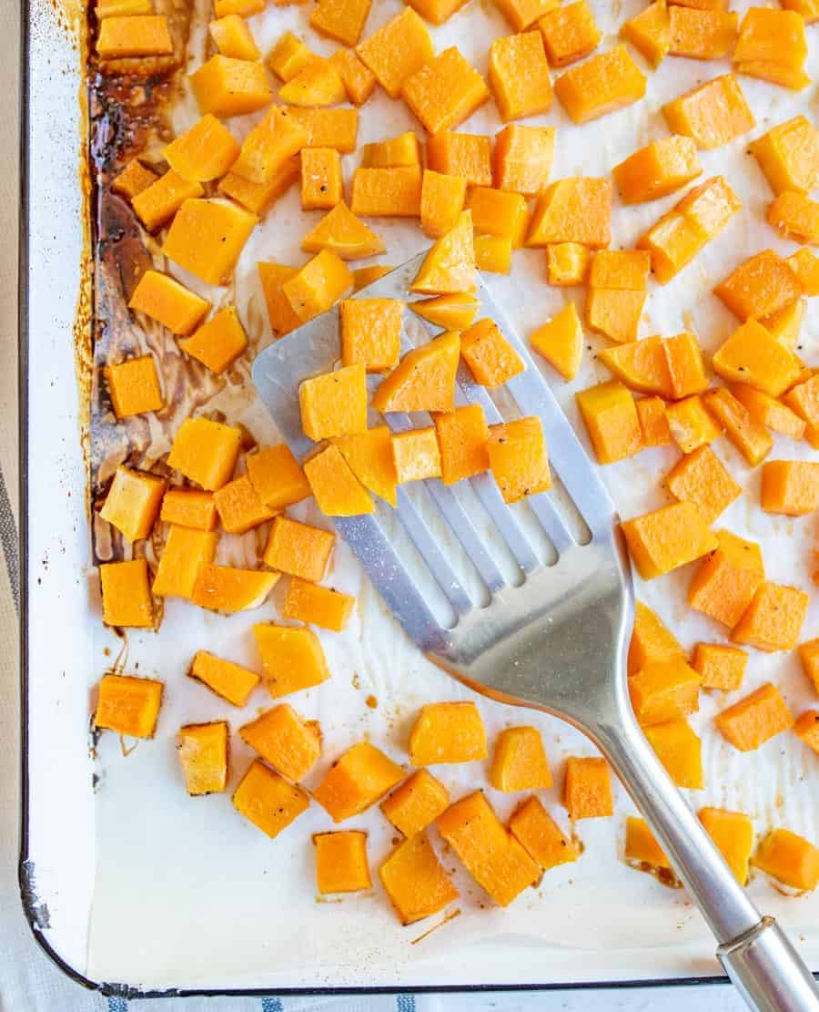 Quick and easy recipe for maple roasted butternut squash cubes that are cooked in the oven and make a perfect healthy side dish.