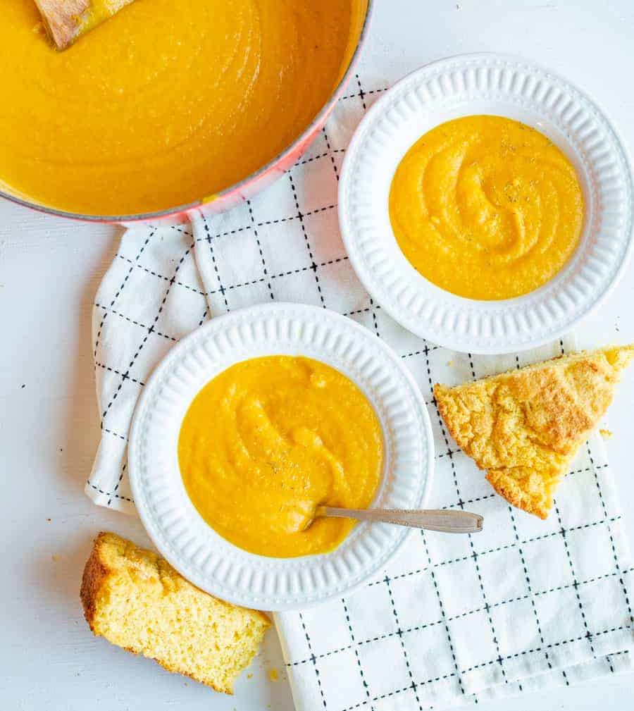 Simple curried butternut squash soup made on the stove top with fresh butternut squash, coconut milk, spices, and a few surprise ingredients!