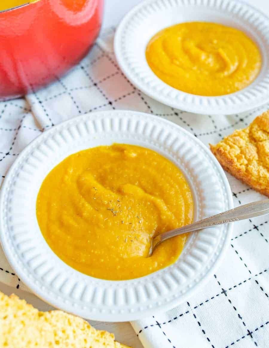 Simple curried butternut squash soup made on the stove top with fresh butternut squash, coconut milk, spices, and a few surprise ingredients!