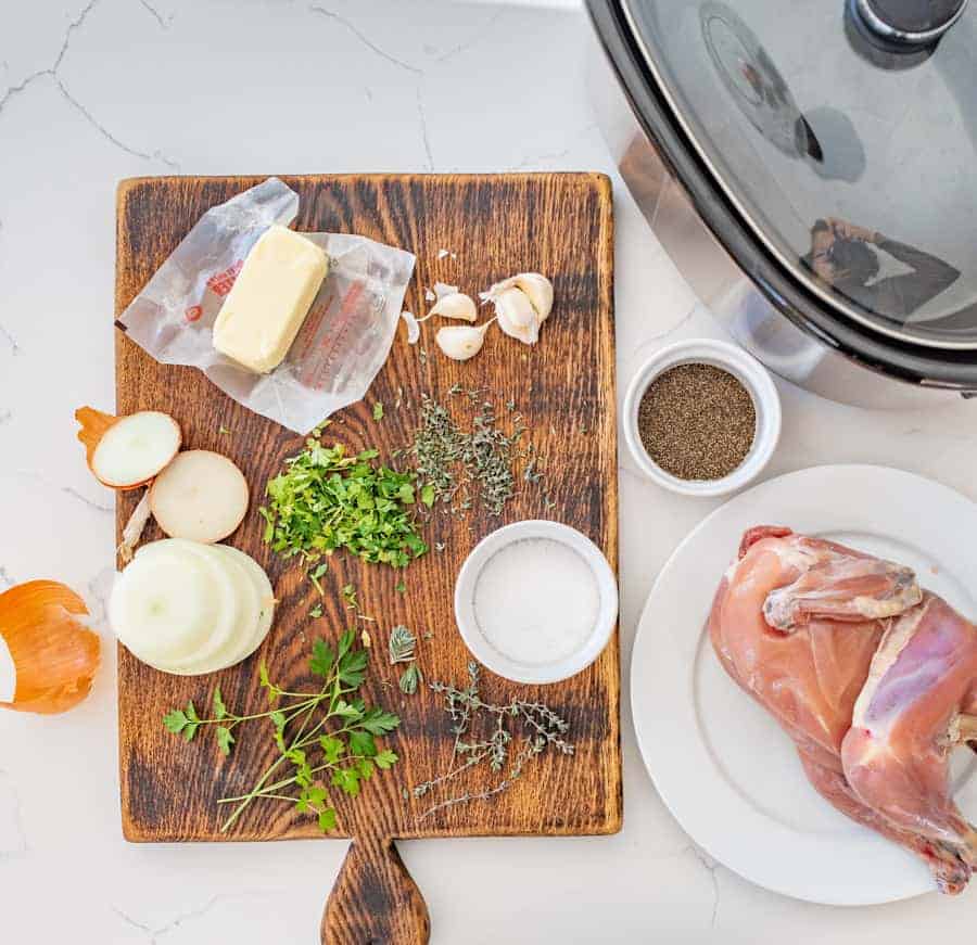 A simple way to cook whole chicken in the crock pot by using lots of fresh herbs and butter for an extra tender and delicious chicken with very little hands on prep time.