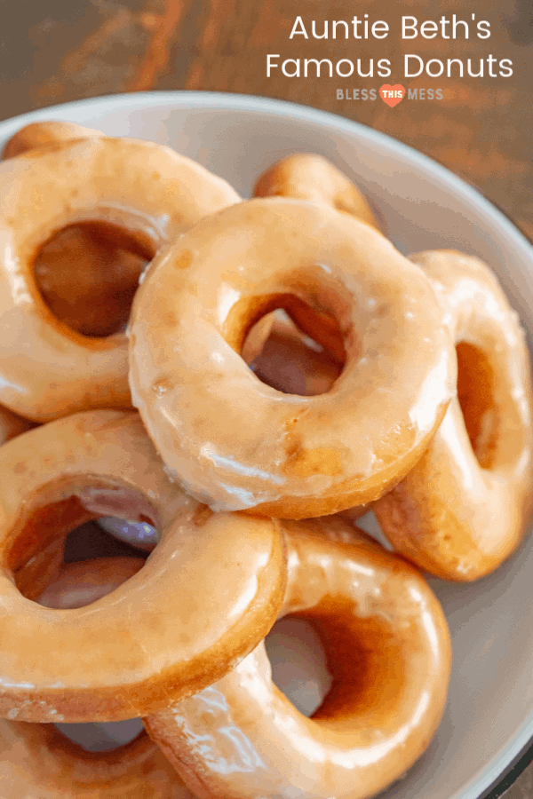 Title Image for Auntie Beth's Famous Donuts and a white bowl with a pile of homemade glazed donuts