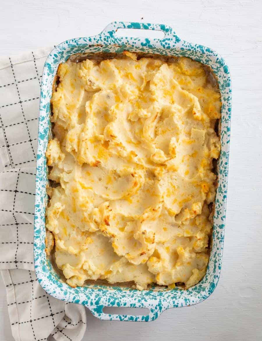 Homemade shepherd's pie made with ground meat, vegetables, a simple seasoning and the most delicious cheesy mashed potato topping. 