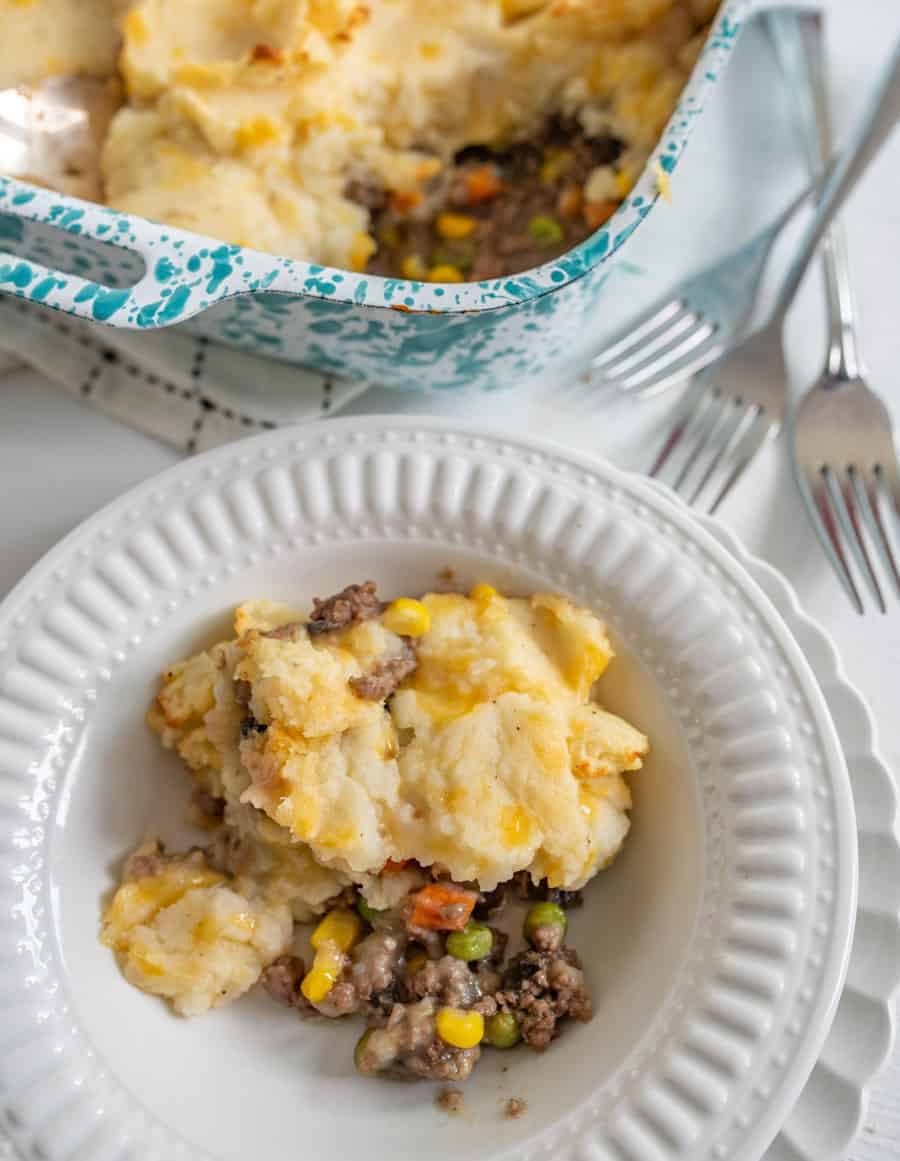 Homemade shepherd's pie made with ground meat, vegetables, a simple seasoning and the most delicious cheesy mashed potato topping. 