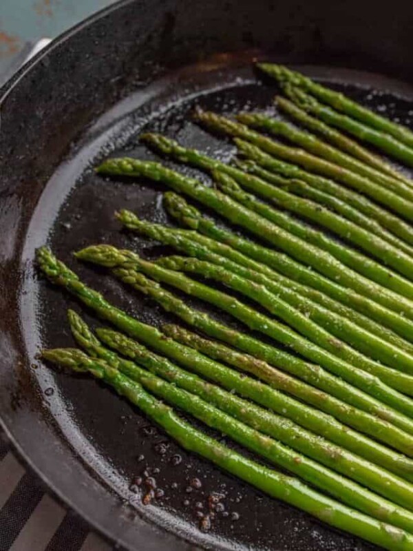 close up of cooked asparagus in cast iron