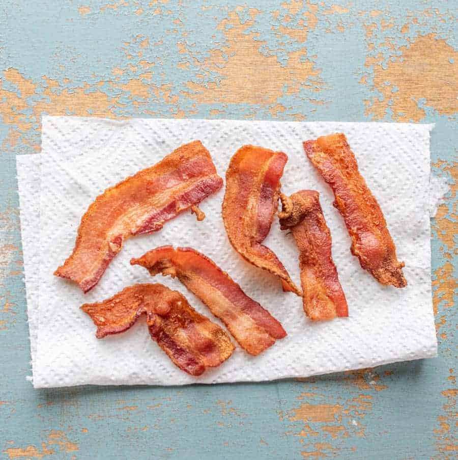 Simple directions on how to bake bacon in the air fryer which is very quick, less messy than traditional frying, and makes the crispy bacon you've had.