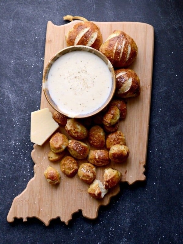 Delicious Parmesan Pretzel Bites made with Italian seasoning and Parmesan cheese dipping sauce make the perfect snack or appetizer.
