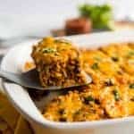 This easy, meatless meal is like a rice-and-bean-layered enchilada casserole. Topped with green or red enchilada sauce (you pick!) and cheese, you'll be satisfied with this savory rendition of a classic Tex-Mex dish.