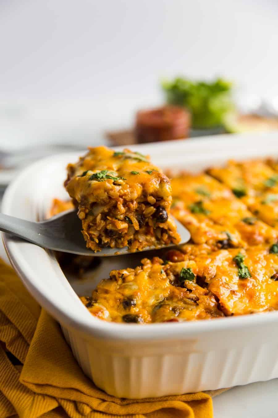 This easy, meatless meal is like a rice-and-bean-layered enchilada casserole. Topped with green or red enchilada sauce (you pick!) and cheese, you'll be satisfied with this savory rendition of a classic Tex-Mex dish.