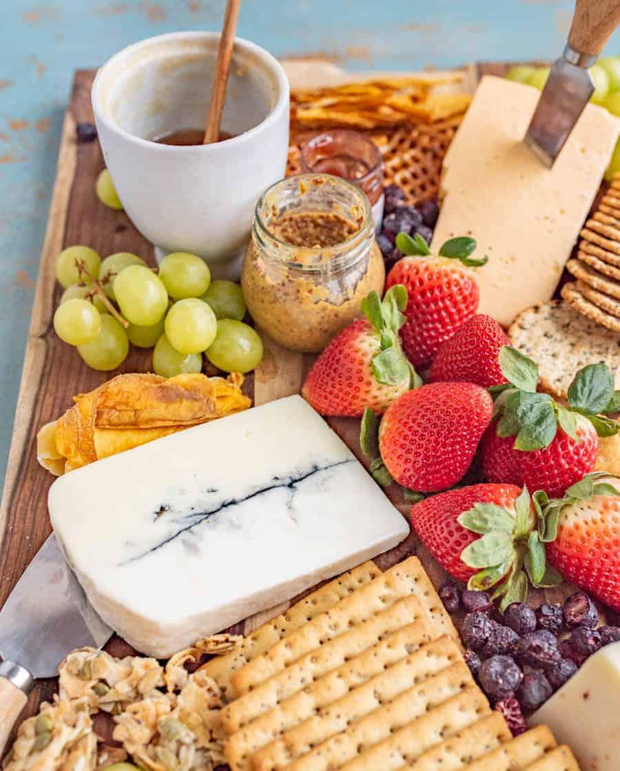 This classic cheese board has a little something for everyone! I like to fill my cheese boards with sweet, savory, and salty elements to round out the flavors and textures.