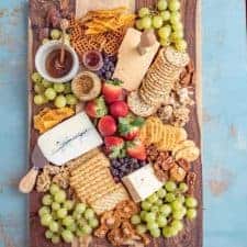 This classic cheese board has a little something for everyone! I like to fill my cheese boards with sweet, savory, and salty elements to round out the flavors and textures.