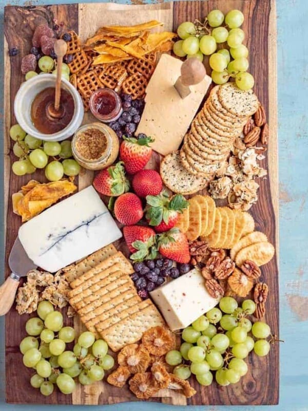 This classic cheese board has a little something for everyone! I like to fill my cheese boards with sweet, savory, and salty elements to round out the flavors and textures.