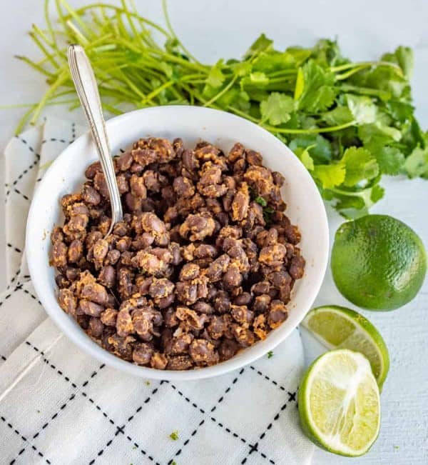 This Cafe Rio Black Beans recipe is a perfect side for taco night! Flavorful, salty, and slightly acidic, they fill out any meal and are the easiest to make!