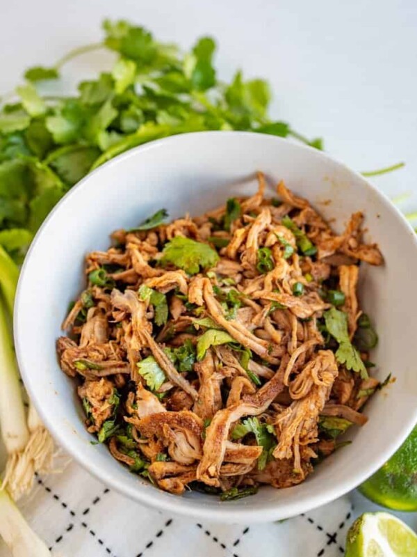This crockpot Cafe Rio sweet pork barbacoa recipe is a lifesaver for busy weeknights. I love a good “toss it all in the slow cooker and forget about it ‘til dinner time” meal, don’t you?