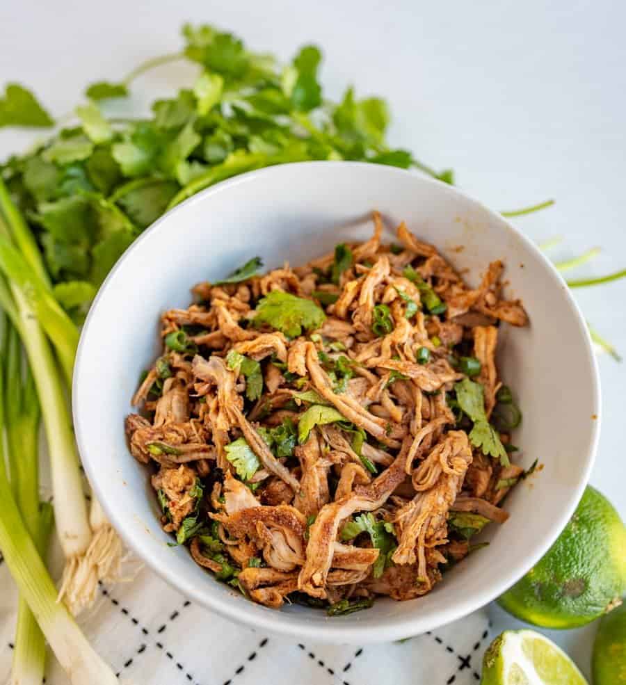 This crockpot Cafe Rio sweet pork barbacoa recipe is a lifesaver for busy weeknights. I love a good “toss it all in the slow cooker and forget about it ‘til dinner time” meal, don’t you?