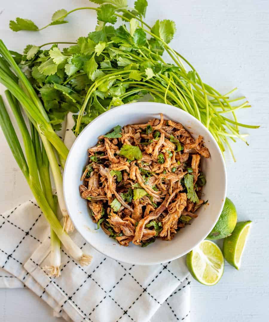 This crockpot Cafe Rio sweet pork barbacoa recipe is a lifesaver for busy weeknights. I love a good “toss it all in the slow cooker and forget about it ‘til dinner time” meal, don’t you?