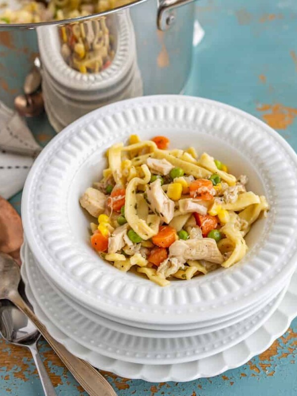 This comforting Chunky Chicken Noodle Soup will brighten any gloomy day and combat any head cold with its hearty combination of shredded chicken (or turkey), egg noodles, carrots, peas, corn, and lots of flavor-packing spices.