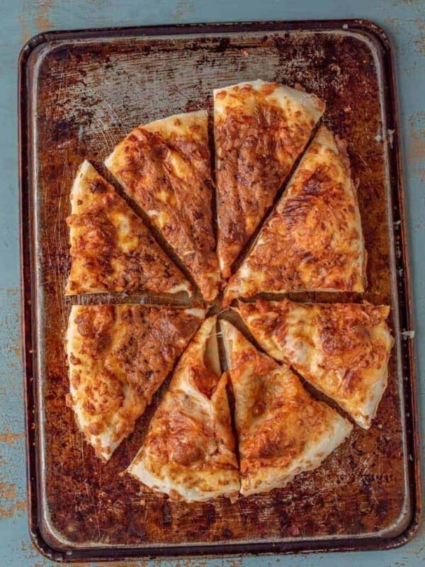 an overhead shot of no-knead pizza dough on a pan. Baked until golden brown.