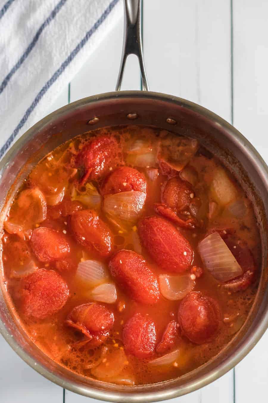 Simple Cream of Tomato Soup comes together quickly to make a creamy and lush soup with canned tomatoes, some onion and garlic, a little butter, and a few splashes of chicken broth and whole cream.