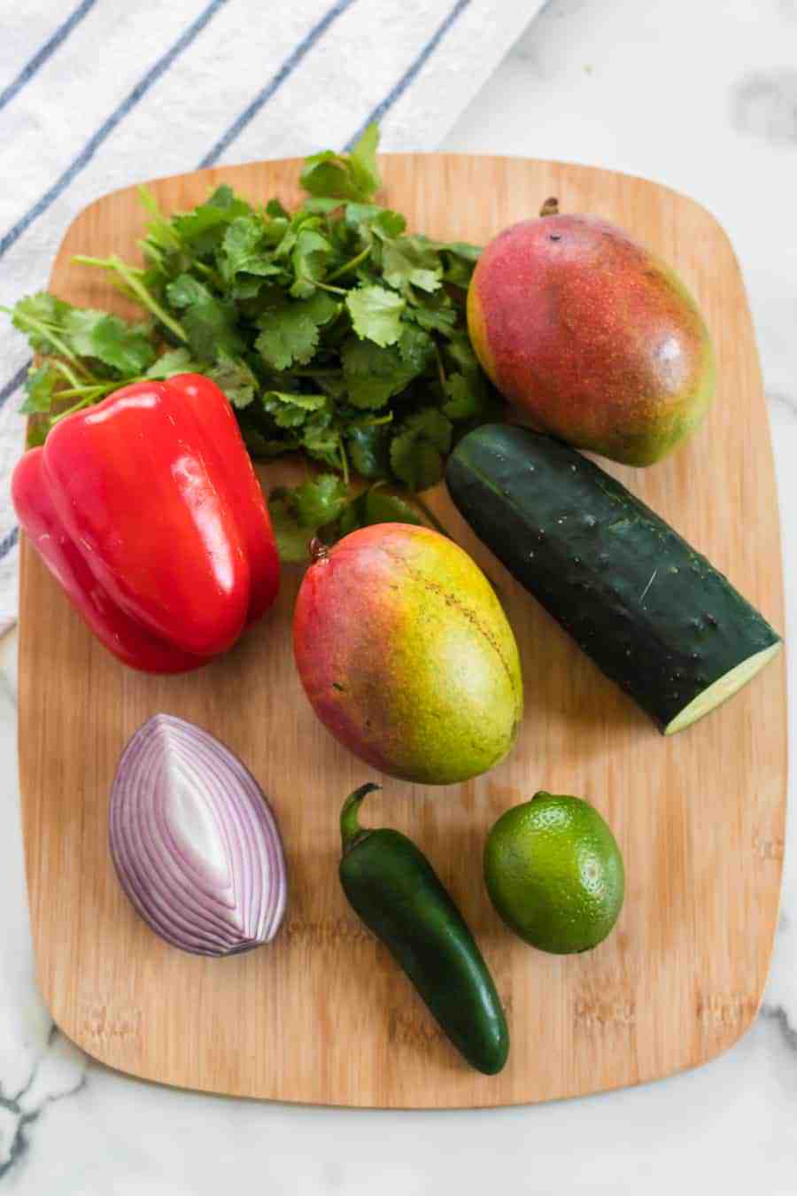 Vibrant, bright flavors come together in my Mango Salsa with red bell pepper, cucumber, red onion, cilantro, lime juice, and of course, the star of this show: fresh mango!