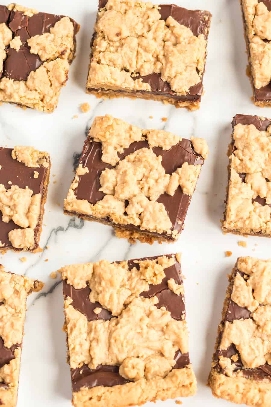 Perfectly equal parts chewy, crusty, and soft, these Peanut Butter Oat Jumbles bars are one of the best chocolate-peanut butter cookie desserts around.