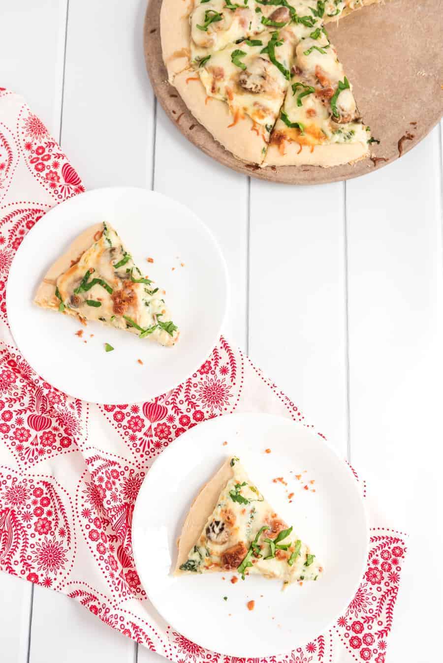 Take your homemade pizza to new heights with this recipe featuring chicken, bacon, and mushrooms slathered in melted cheese and creamy sauce.