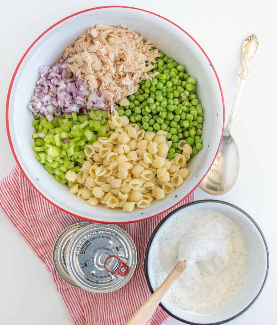 A light and refreshing Classic Tuna Pasta Salad comes together as the perfect summer side dish with white tuna, shell noodles, celery, peas, and a creamy dill sauce.