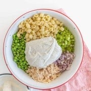 A light and refreshing Classic Tuna Pasta Salad comes together as the perfect summer side dish with white tuna, shell noodles, celery, peas, and a creamy dill sauce.