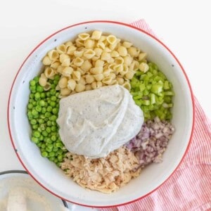 A light and refreshing Classic Tuna Pasta Salad comes together as the perfect summer side dish with white tuna, shell noodles, celery, peas, and a creamy dill sauce.