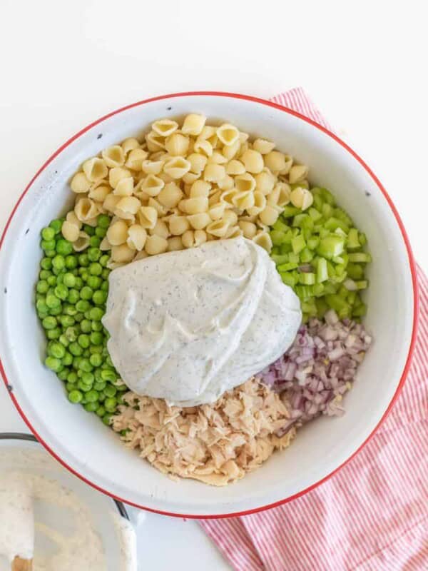 A light and refreshing Classic Tuna Pasta Salad comes together as the perfect summer side dish with white tuna, shell noodles, celery, peas, and a creamy dill sauce.