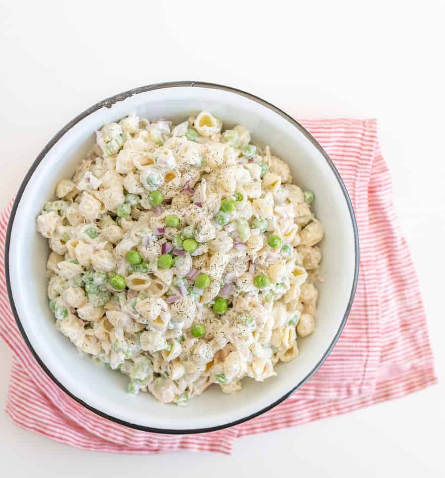 A light and refreshing Classic Tuna Pasta Salad comes together as the perfect summer side dish with white tuna, shell noodles, celery, peas, and a creamy dill sauce.