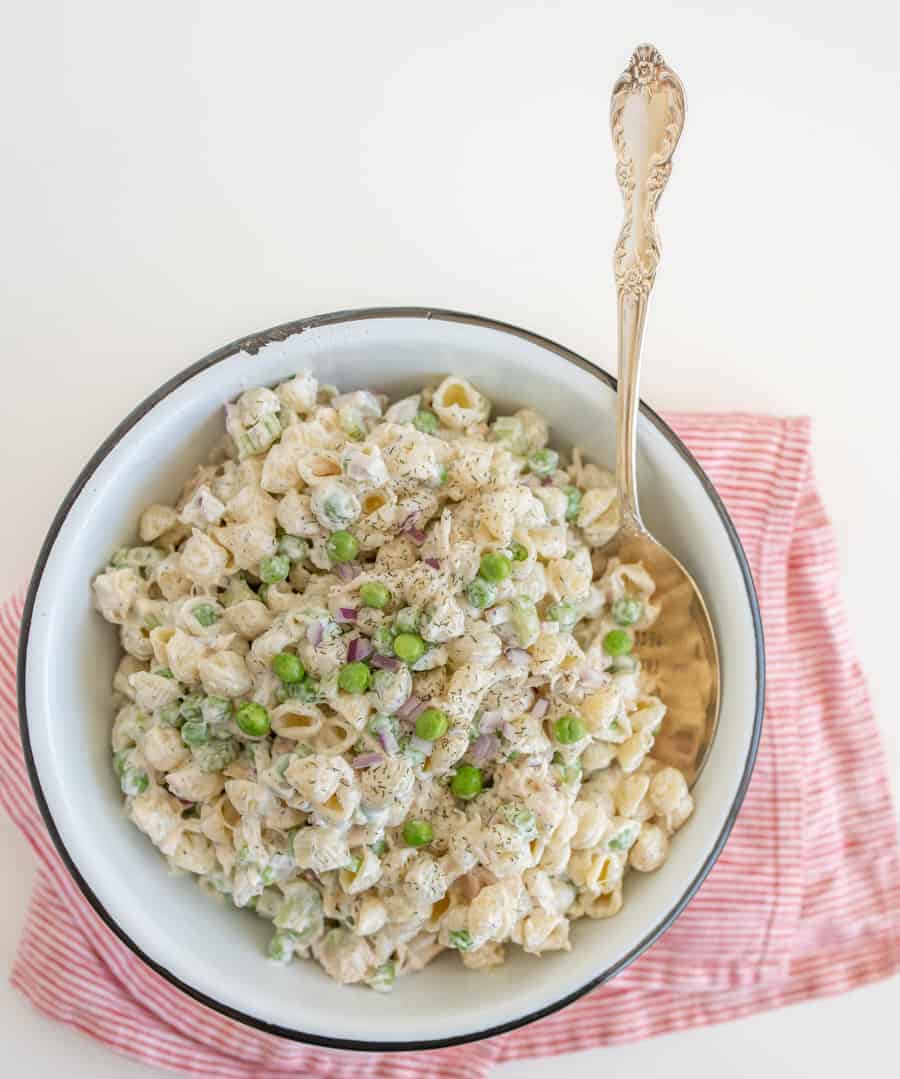 A light and refreshing Classic Tuna Pasta Salad comes together as the perfect summer side dish with white tuna, shell noodles, celery, peas, and a creamy dill sauce.