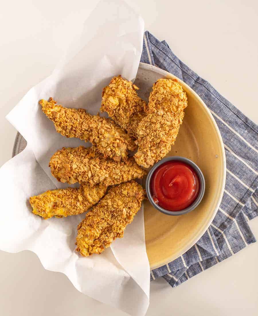 Extra Crunchy Baked Chicken Strips are a delicious spin on fried chicken strips, without the splatter on your stovetop (score!). The Fire Roasted Vegetable flavor of Milton's crackers brings the crunch and full flavor to this seriously delectable dish.