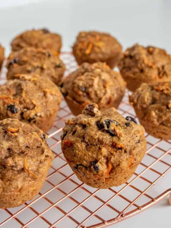 healthy carrot cake muffins on a cooling rack